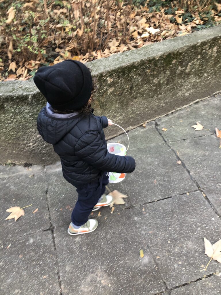 A little boy carrying a paper lantern at a St. Martin's Day celebration in Germany