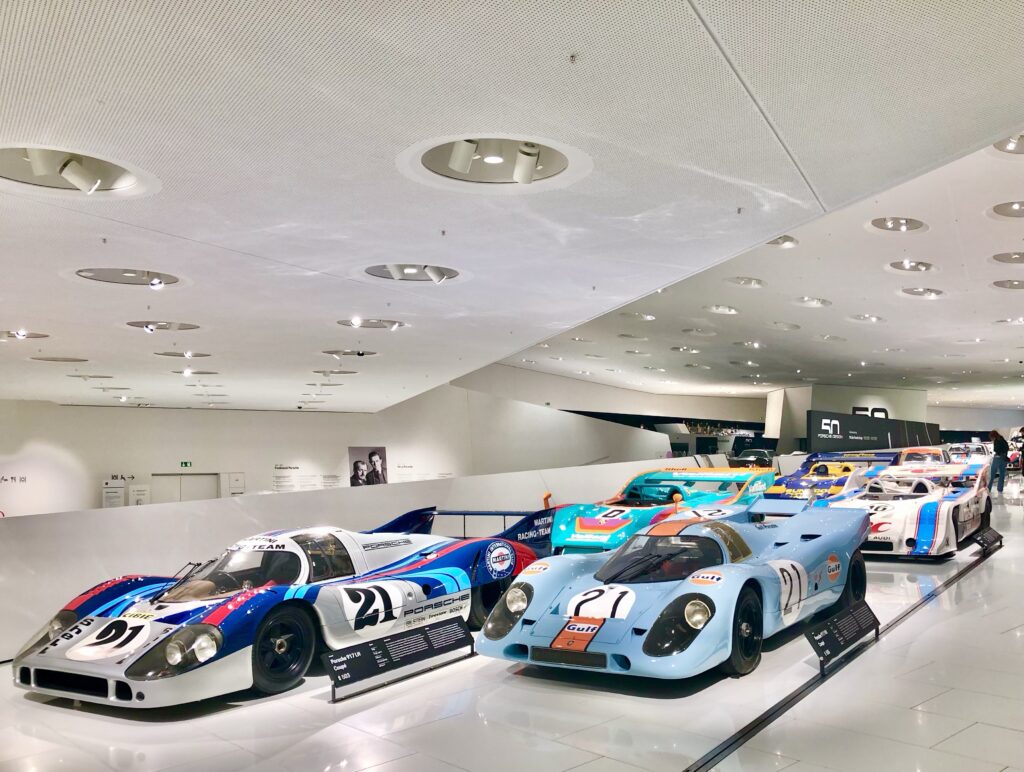 porsche race cars showcased in the porsche museum in stuttgart, germany