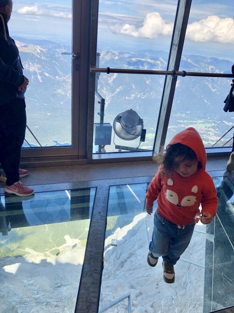 A little boy stands in a cable car as it ascends to the top of the Zugspitze, Germany's highest mountain in Garmisch. 