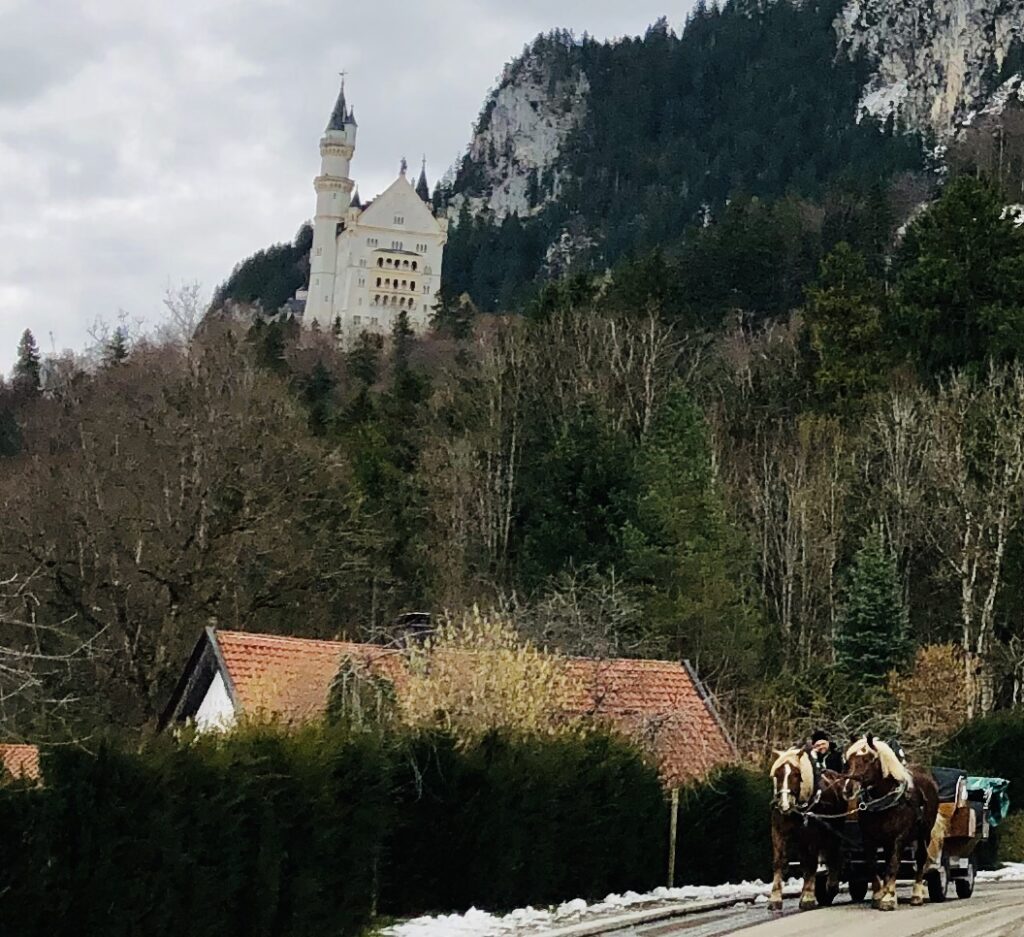 View near the horse-drawn carriages at Neuschwanstein Castle in Germany. 