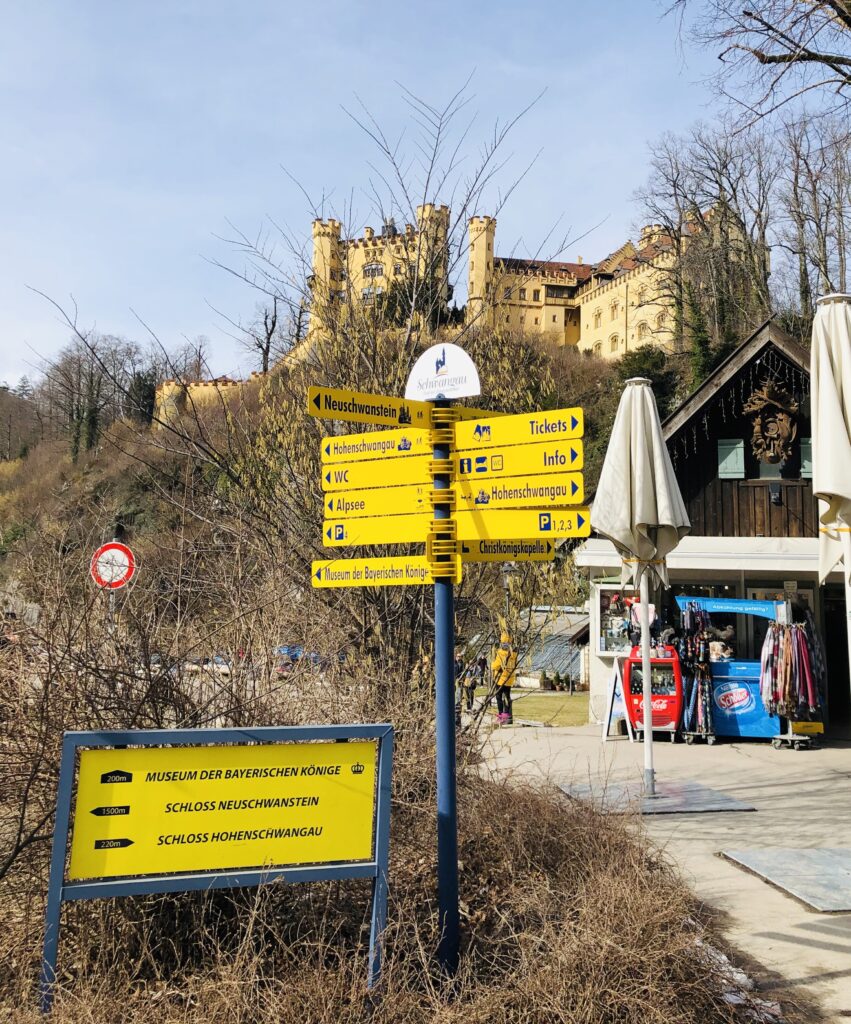 Signs leading visitors to each area of the famous Hohenschwangau and Neuschwanstein Castles in Bavaria, Germany. 